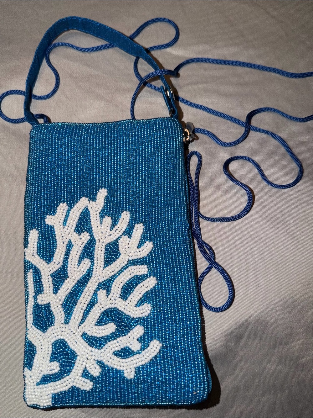 Bamboo Trading Company Blue Beaded Crossbody Phone Bag with White Coral Accent